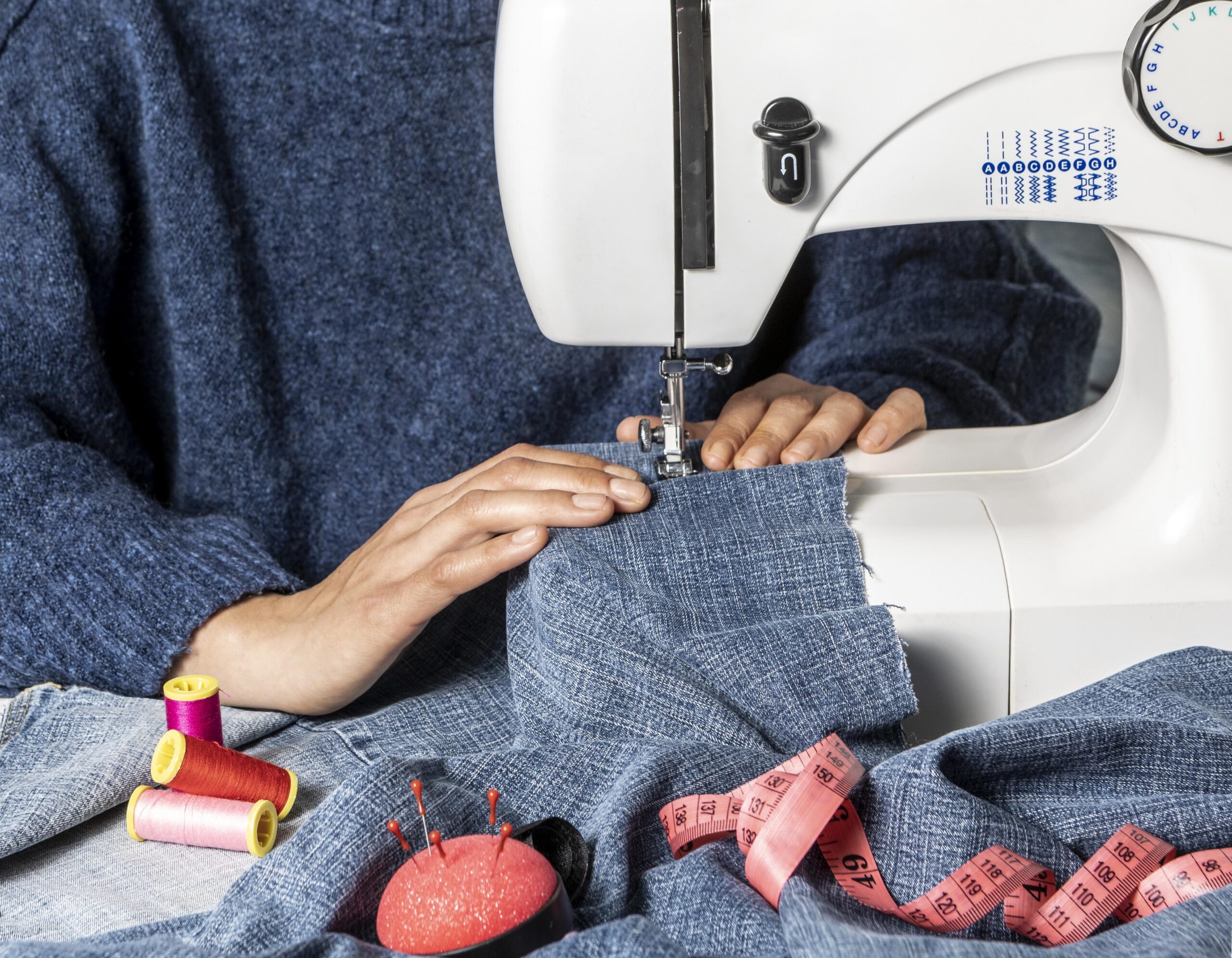 hands-sewing-with-machine-close-up